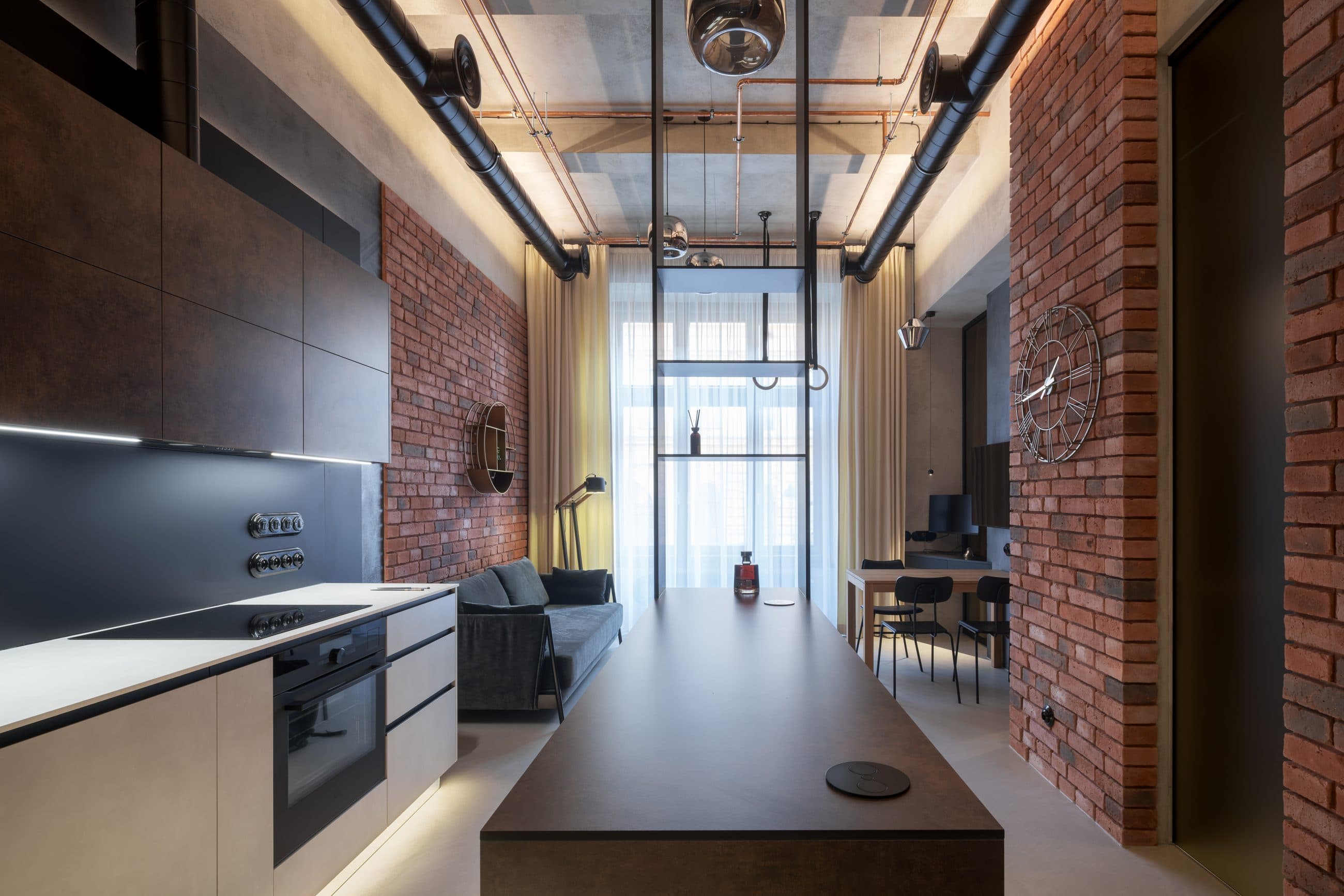 Loft apartment with brick walls and a dark kitchen, Výtoň